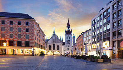 Fototapeta premium Munich Old town, Marienplatz square and the Old Town Hall tower, Germany, on dramatical sunrise