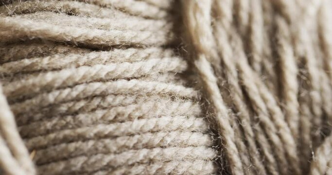 Close-up view of a textured, twisted natural fiber rope, with copy space