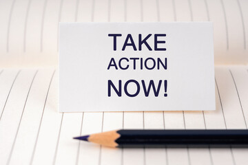 Take Action Now text on a paper note