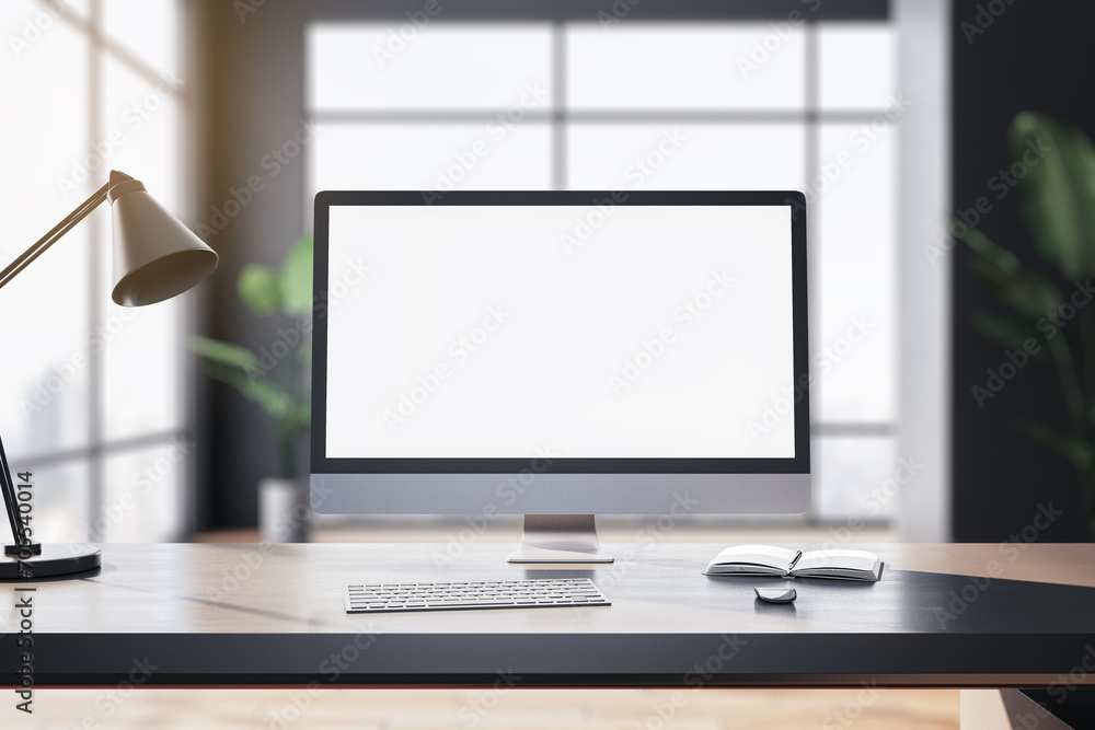 Aufkleber Modern designer table with white computer monitor, coffee cup, supplies, other objects and window with city view in the background. Mock up, 3D Rendering.