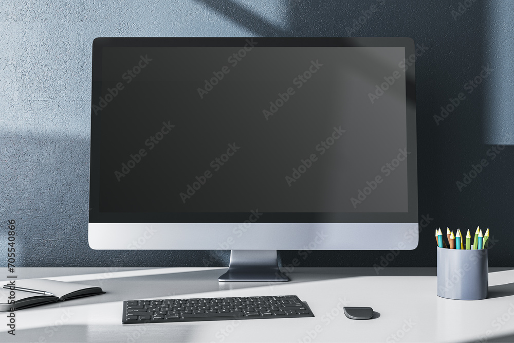 Poster Modern designer office desktop with empty mock up computer monitor, supplies and other items on gray wall background. 3D Rendering.