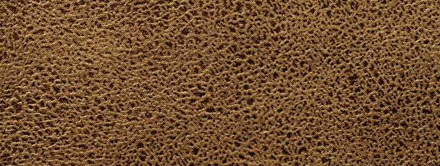 Brown background from a soft upholstery textile material, closeup.