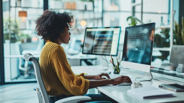 Businessman Sitting At The Office Table Working On Computer At Night Of Working Late