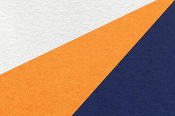 Texture of old craft white, orange and navy blue color paper background, macro. Vintage abstract...