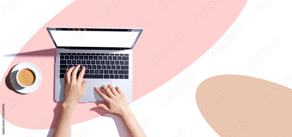 Poster person using a laptop computer from above