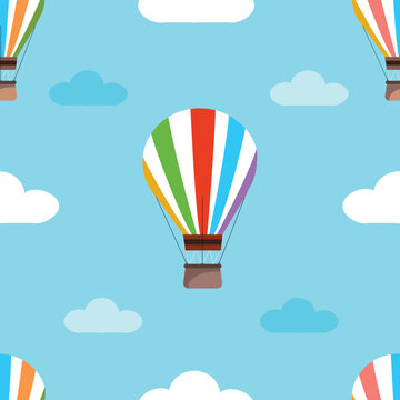  seamless pattern with hot air balloons and clouds. Hand drawn balloon in the sky.fabric,  textiles, clothing, packaging, interior.