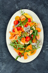 Vegetable salad with pasta.