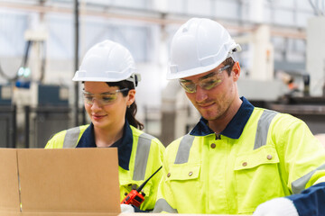 Professional worker team in safety uniform, supervisor inspector in packaging stock order at cardboard factory warehouse, piles of stacking paper manufacture, recycling industrial production