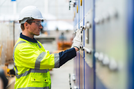 Electrical engineer inspection control panel and commissioning during pressure steam drum, Electric control panel open enclosure for automatic circuit system in industrial factory, switchgear box