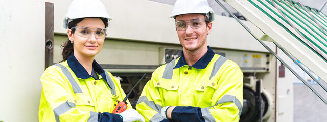 professional technician engineer with safety helmet hard hat working in industrial manufacturing factory, men at work to checking equipment of machinery production technology or construction operating