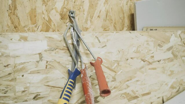 Construction tool for painting. In the workshop there are clasp handles for painting work. Background video.