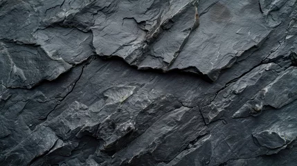 Fotobehang Rough mountain terrain in dark grey, displaying cracks and providing a textured black stone background. Abundant space for design elements.  © Matthew