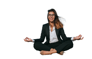 Relaxed businesswoman in a suit practices meditation in front of a modern office building, blending mindfulness with corporate life
