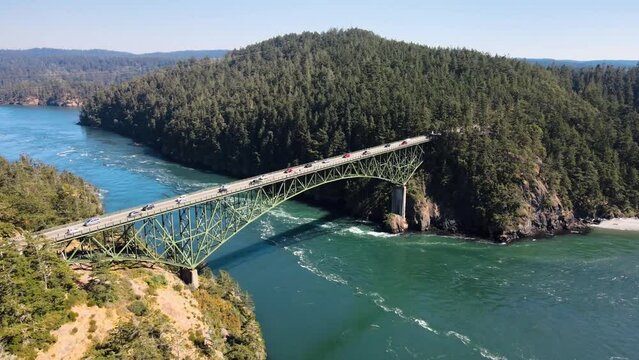 Aerial orbiting shot of Deception Pass in Washington connecting 2 islands
