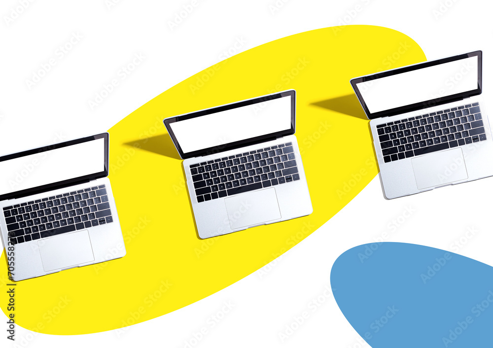 Poster three laptop computers with shadow - flat lay