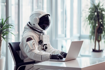 Astronaut working on a laptop in office - obrazy, fototapety, plakaty