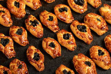 Olive pastry. Freshly baked olive cookies on a white background