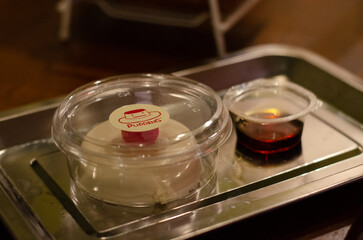 Kiwi cream pudding, Panna Cotta with kiwi sauce, on a plate. Light gray background 