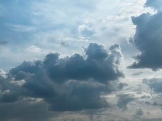 Experience the Calmness of a Clear Day as White Clouds Waltz Across the Deep Blue Sky