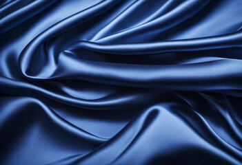 Obraz premium Deep blue silk satin fabric. Elegant abstract background. Liquid wave effect or silk with soft wavy folds. Beautiful navy blue fabric background with copy space for your design.