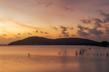 The blurred background of the twilight evening by the river, with a chair to sit while traveling, the atmosphere surrounded by the wind blowing through the cool.