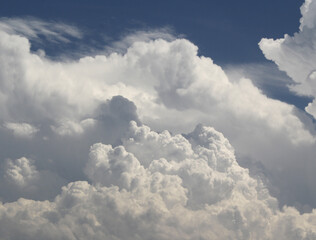 Naklejka na ściany i meble Storm clouds forming against a blue sky