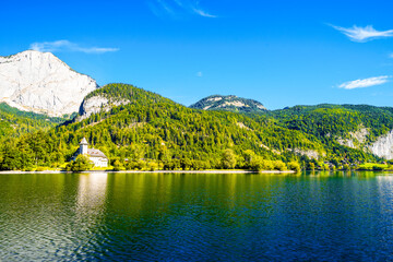 View of the Grundlsee and the surrounding landscape. Idyllic nature by the lake in Styria in Austria. Mountain lake at the Totes Gebirge in the Salzkammergut.
