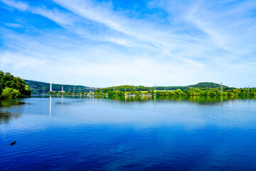 Fototapeta premium View of the Harkortsee and the surrounding landscape. Nature by the lake on the Ruhr. Lake in the Ruhr area. 