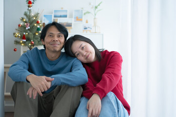 wellness at home concept with asian couple happy decorate house and relax at living room