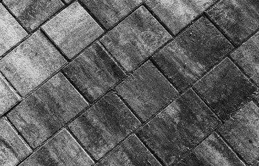 Gray concrete cobble road background, paving slabs pattern