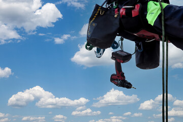 Equipment of industrial mountaineering worker on roof