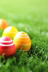 Fototapeta na wymiar Easter eggs on a green meadow at dawn