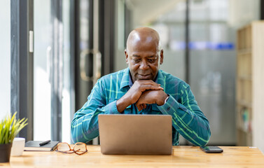 Business senior man 60 years old using laptop computer and thinking about question in office. Happy...