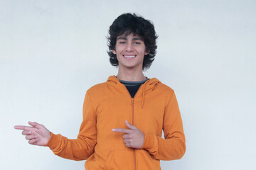 smiling young man doing demonstration with hands