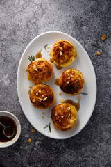 Homemade cheese buns with rosemary and gravy