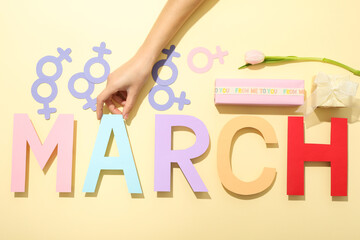 The inscription of March in large multi-colored letters