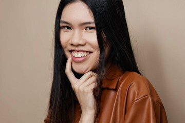 Fototapeta premium Woman femininity cosmetic fashion beautiful asian portrait glamour model beauty hair beige