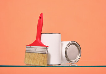 Paint cans and a paint brush. Idea of fashion home design.