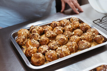 Baking traditional French dessert - Choux Pastry or profiterole pastry balls