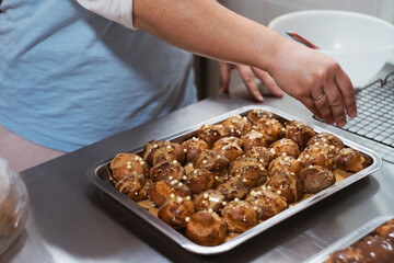 Baking traditional French dessert - Choux Pastry or profiterole pastry balls