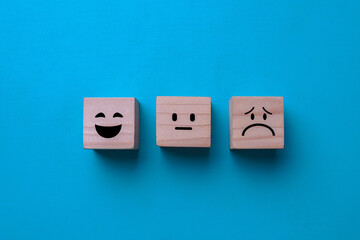 Customer service evaluation, feedback, and satisfaction survey on wooden blocks.
