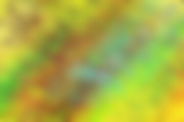 Abstract blurred background image of green, yellow colors gradient used as an illustration. Designing posters or advertisements.