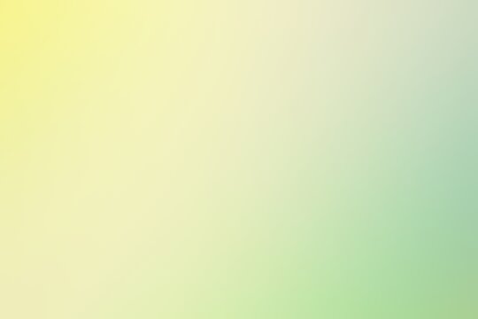 Abstract blurred background image of yellow, green colors gradient used as an illustration. Designing posters or advertisements.