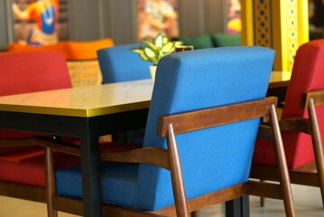 Colorful chair and table in a restaurant, interior design and furniture