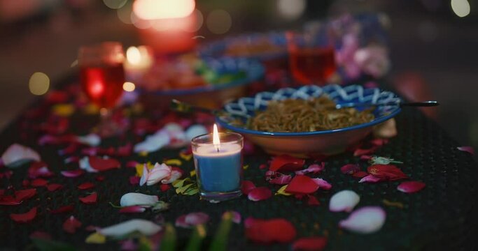 Valentines day date dinner setup couple outdoor modern house garden park night candle light view decor dining table wine drink fresh juice glasses food gift box home cafe no people no people concept