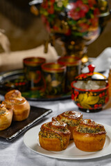 Baked buns with poppy seeds on a white tablecloth. Ukrainian  or Russian style