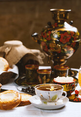 Cup of tea with lemon and honey on a wooden background. Ukrainian  or Russian style