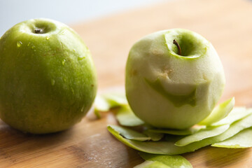 Fresh Organic Peeled Green Apple with Water Drops on Wooden Board - Crisp and Refreshing Delight