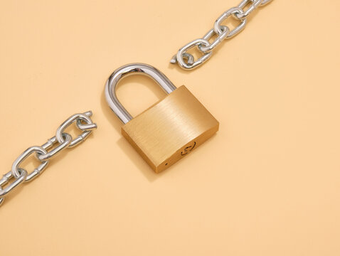 A lock to secure the property. The chain is broken in two parts.