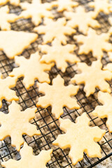 Cooling Snowflake-Shaped Sugar Cookies on a Rack